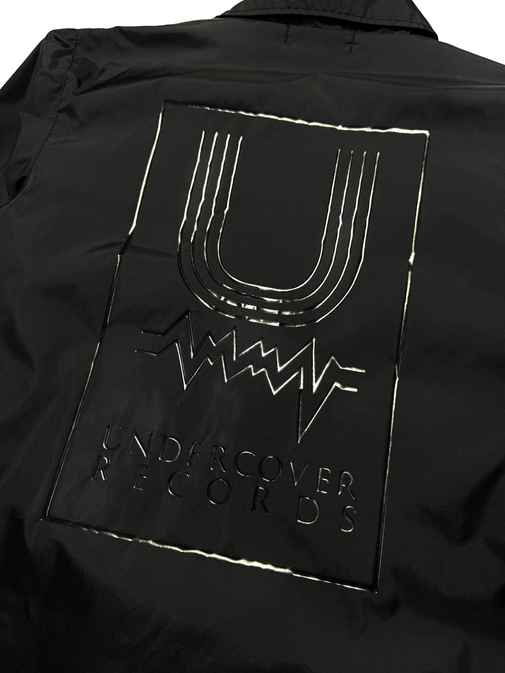 Undercover “Music Record” Black Layered Coach Jacket