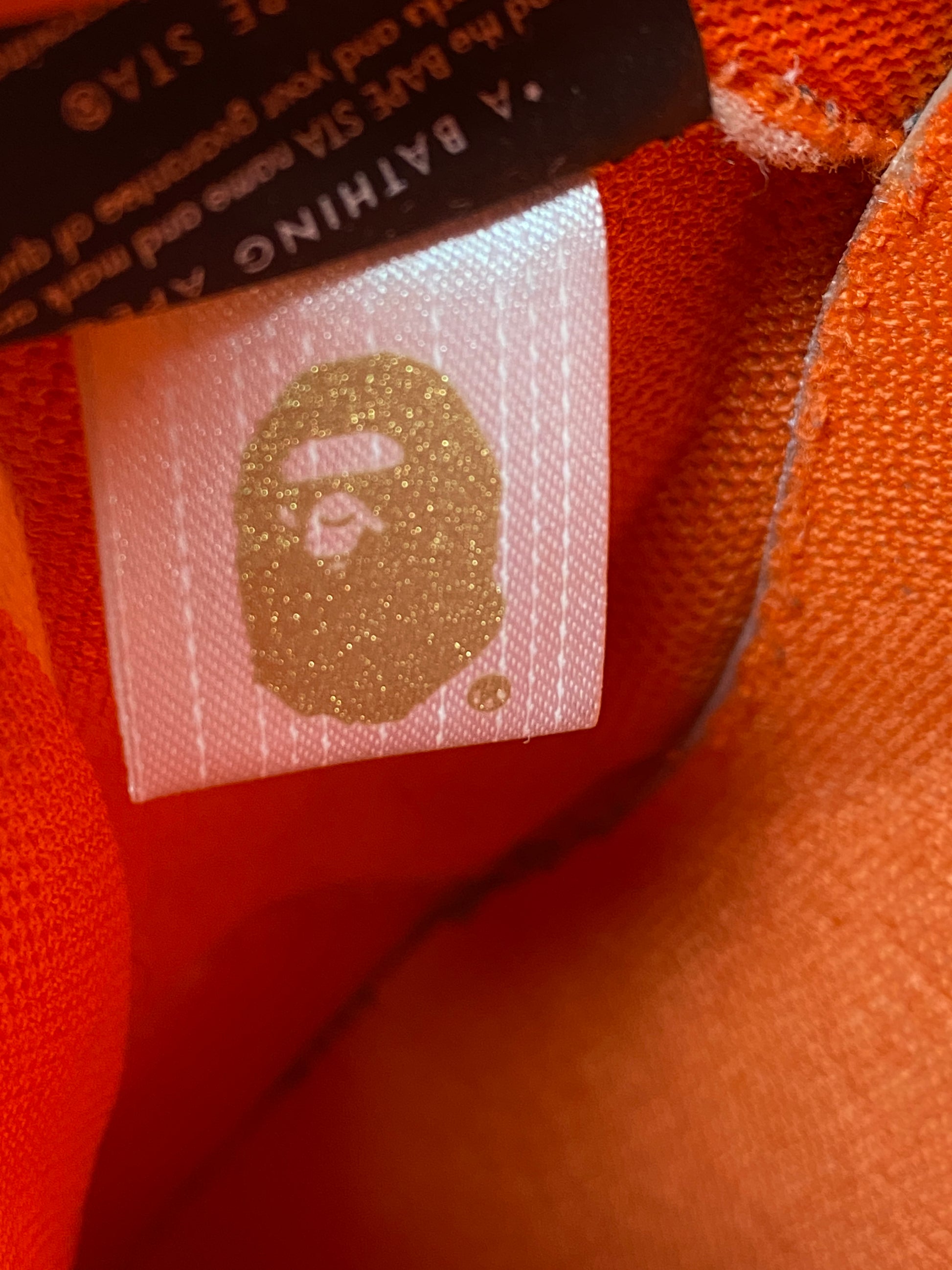 BAPE x Heron Preston Orange Camo BAPESTA